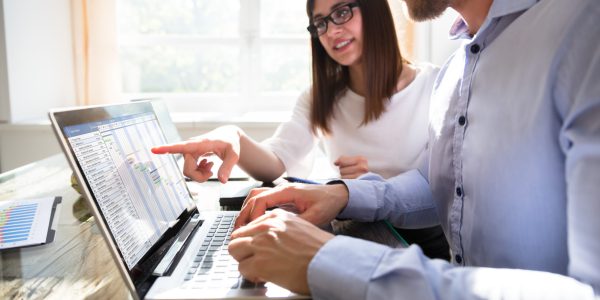 Two Businesspeople Analyzing Gantt Chart